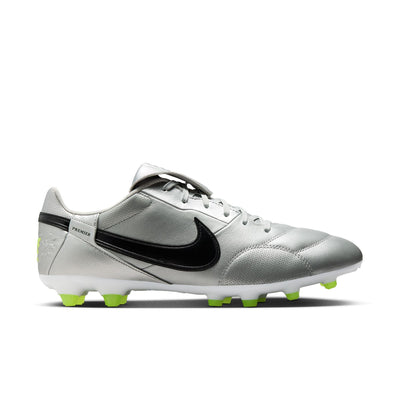 Silver soccer cleat with black Nike logo on a white background